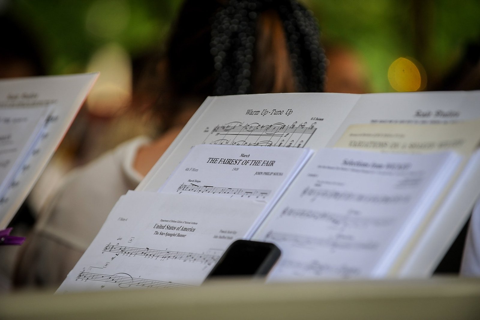 Music on stands at a BCSWE outdoor performance